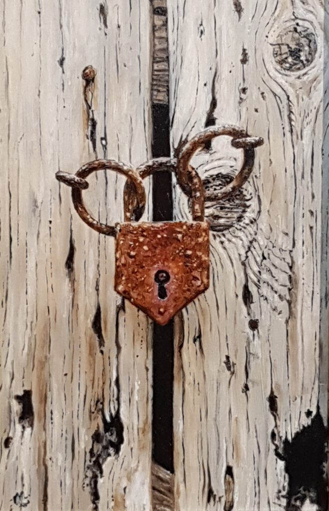 An old lock on an even older door